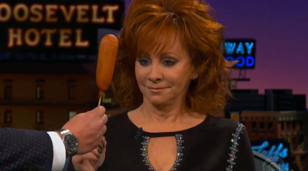 Reba Introduces James Corden To Her Food Obsession: Corn Dogs